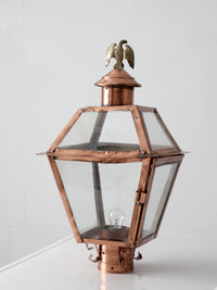 vintage copper lantern light fixture with brass eagle finial
