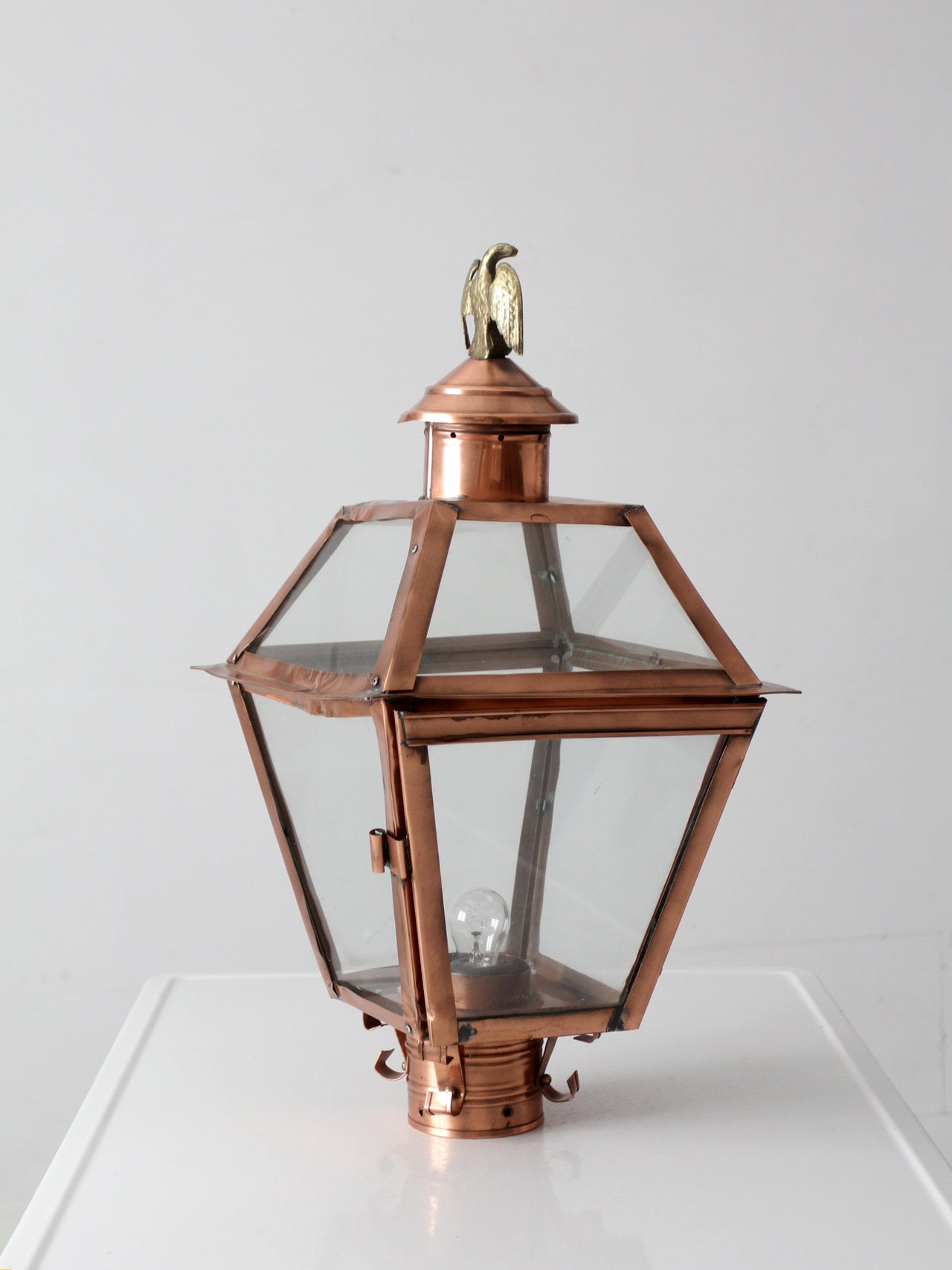 vintage copper lantern light fixture with brass eagle finial