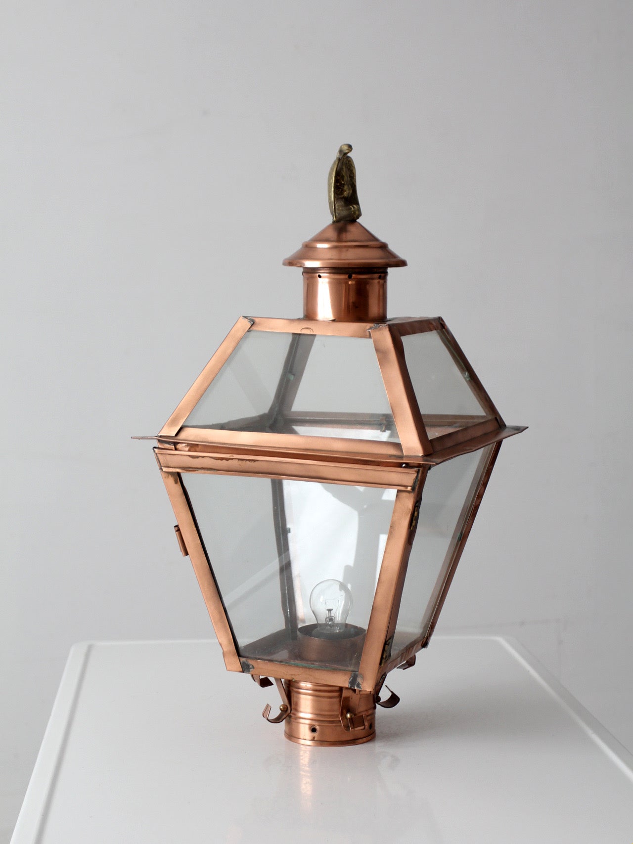 vintage copper lantern light fixture with brass eagle finial