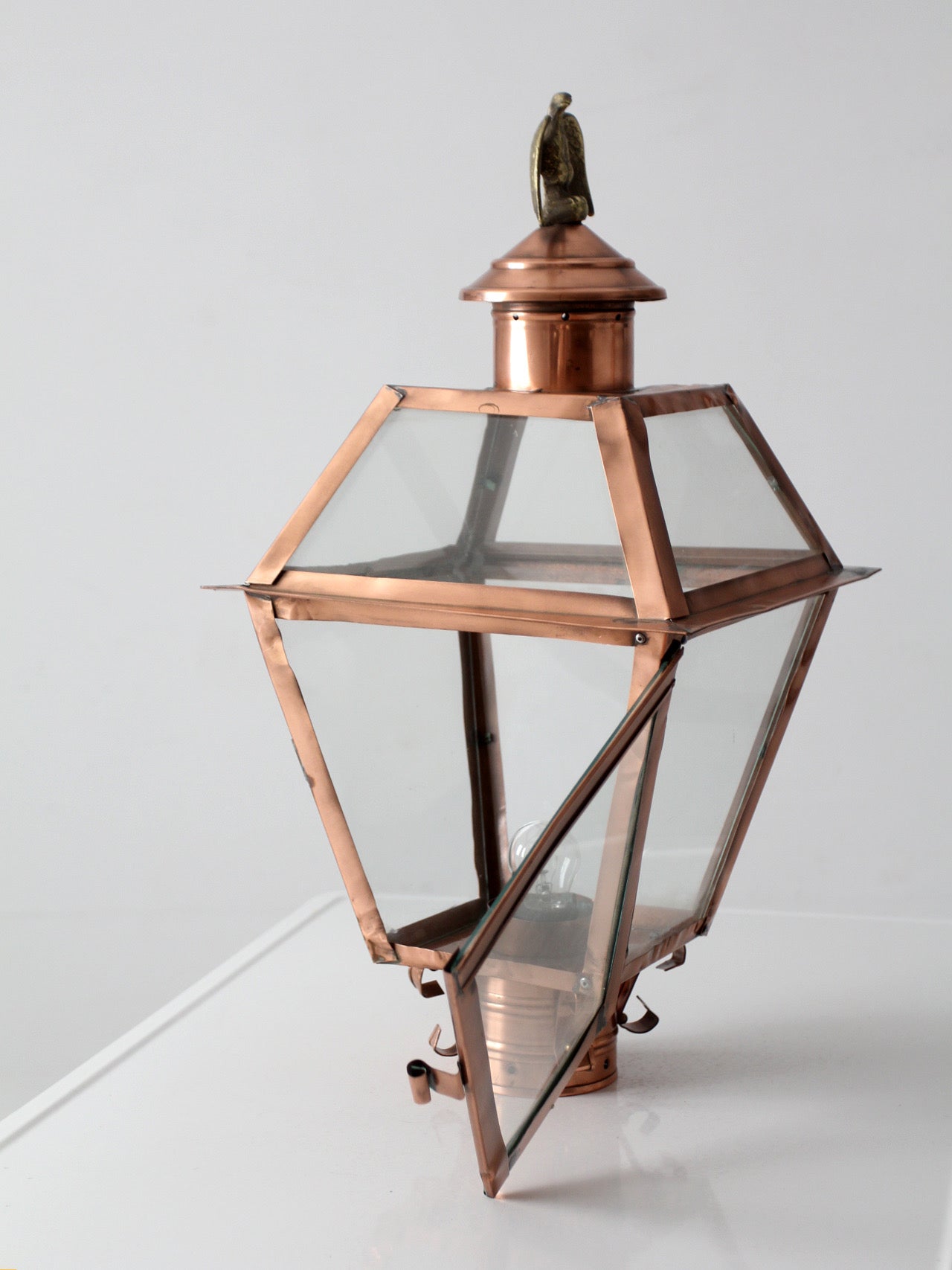 vintage copper lantern light fixture with brass eagle finial