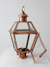 vintage copper lantern light fixture with brass eagle finial