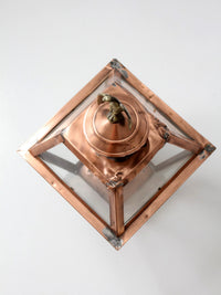 vintage copper lantern light fixture with brass eagle finial