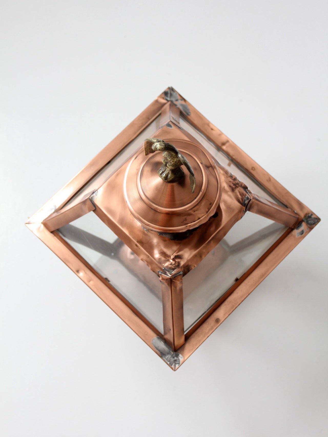 vintage copper lantern light fixture with brass eagle finial