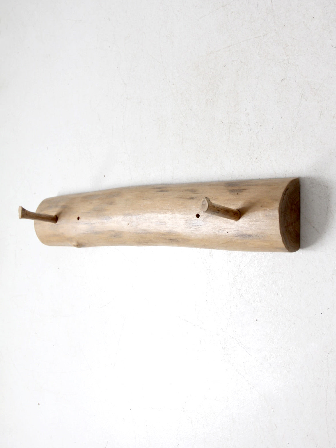 vintage hand-carved pine wall rack with peg hooks