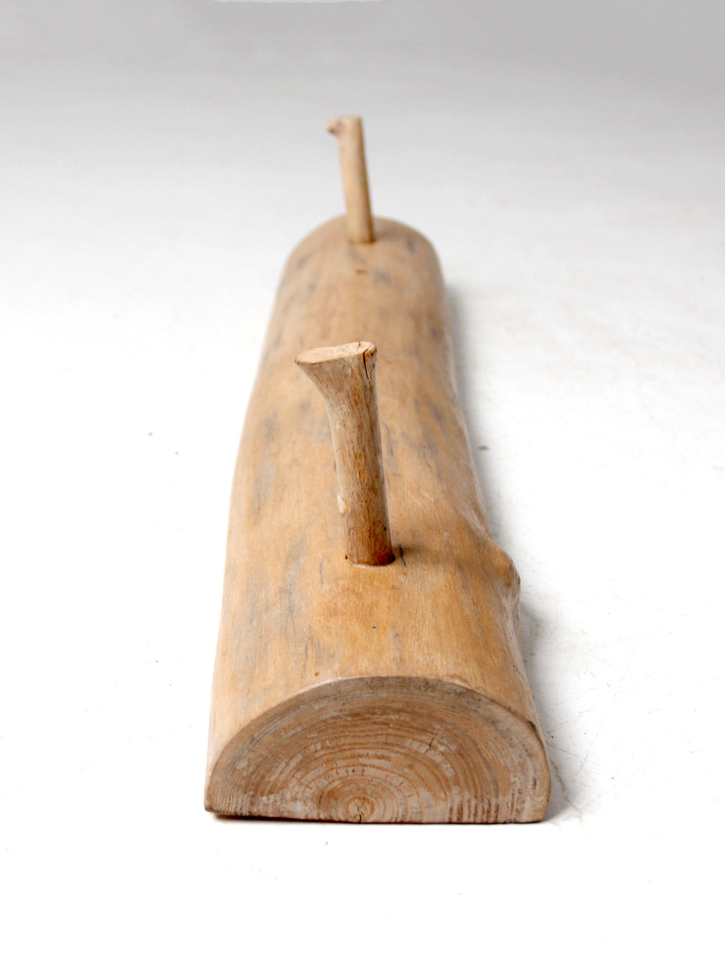 vintage hand-carved pine wall rack with peg hooks