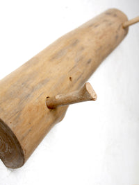 vintage hand-carved pine wall rack with peg hooks