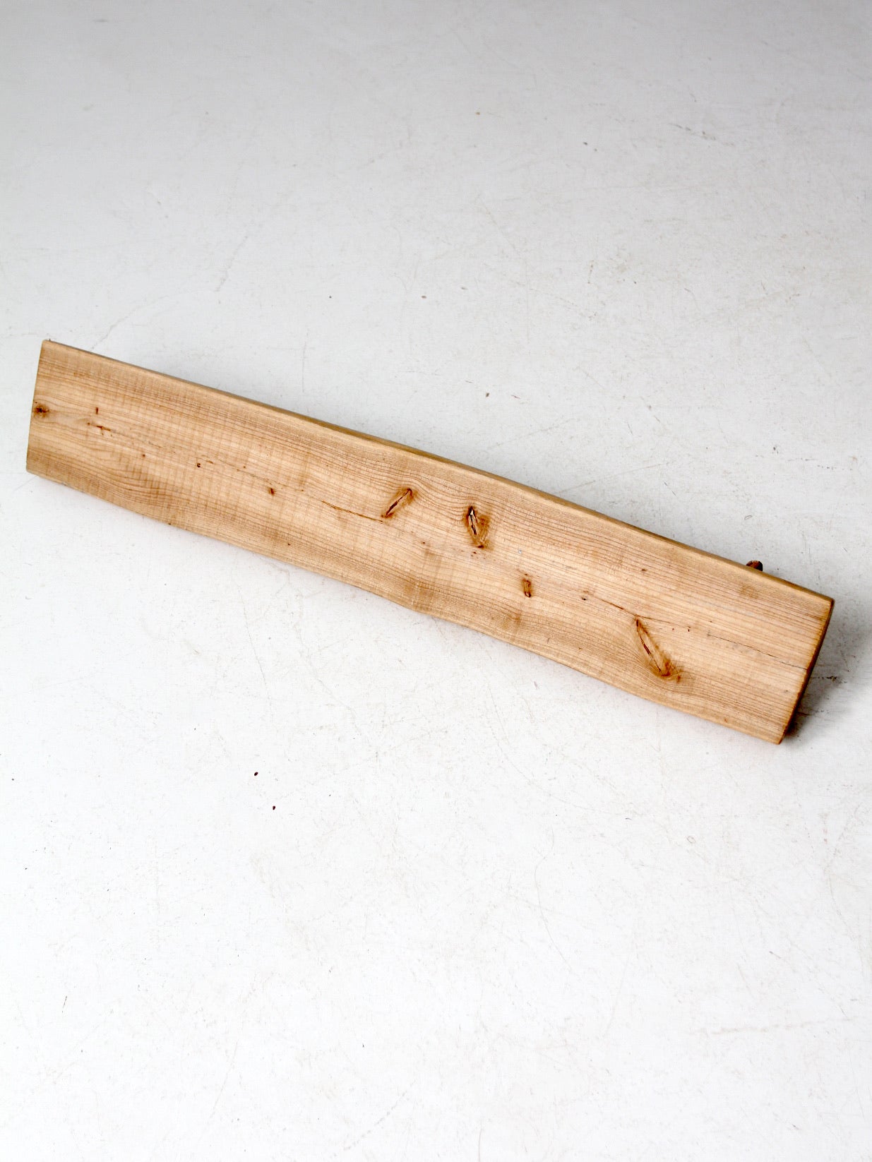 vintage hand-carved pine wall rack with peg hooks