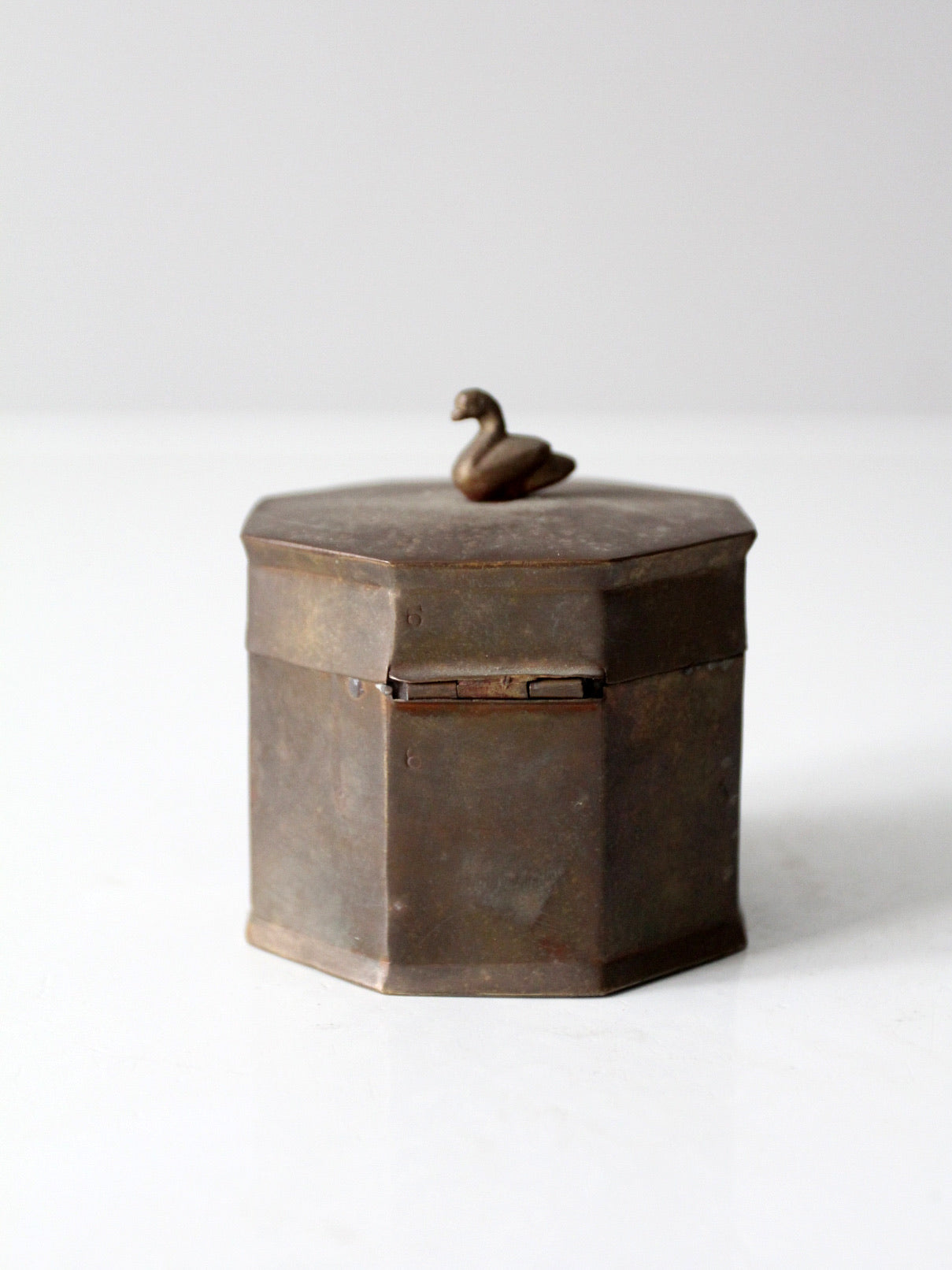mid-century brass box with bird finial