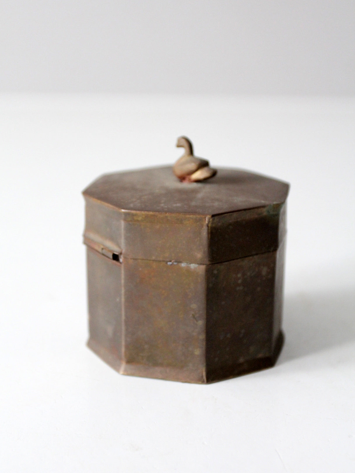mid-century brass box with bird finial