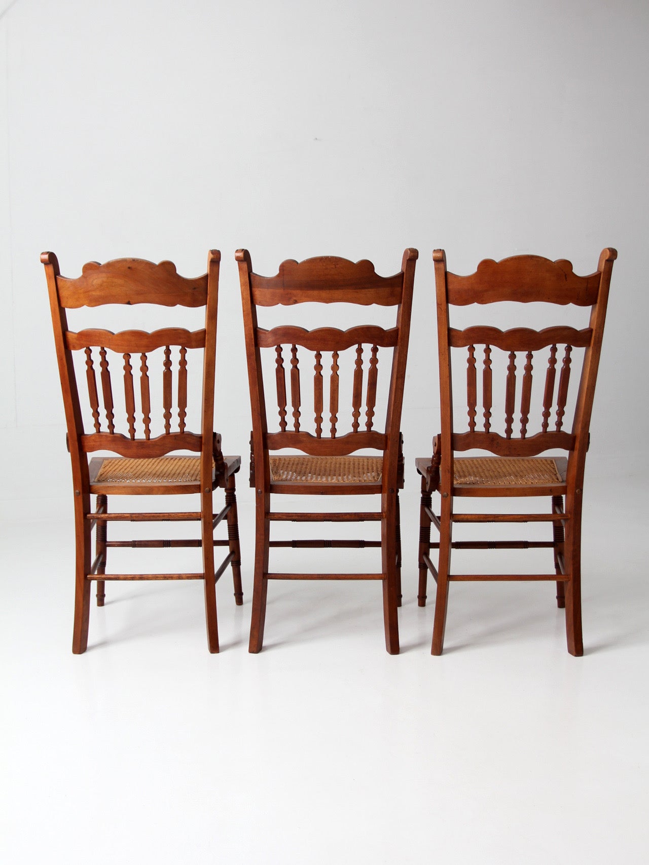 antique Eastlake Revival cane seat dining chairs | set of 3