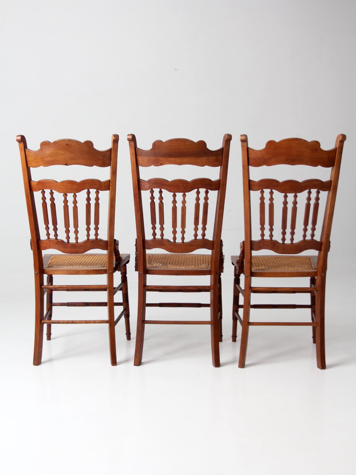 antique Eastlake Revival cane seat dining chairs | set of 3