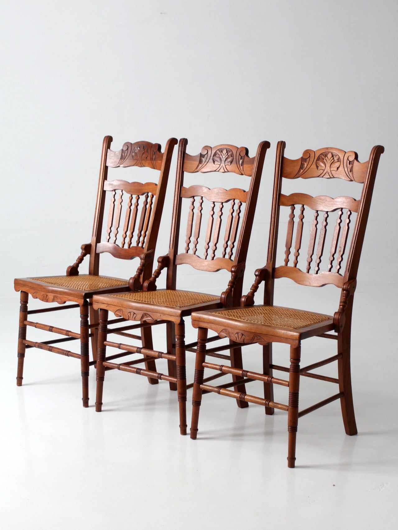 antique Eastlake Revival cane seat dining chairs | set of 3