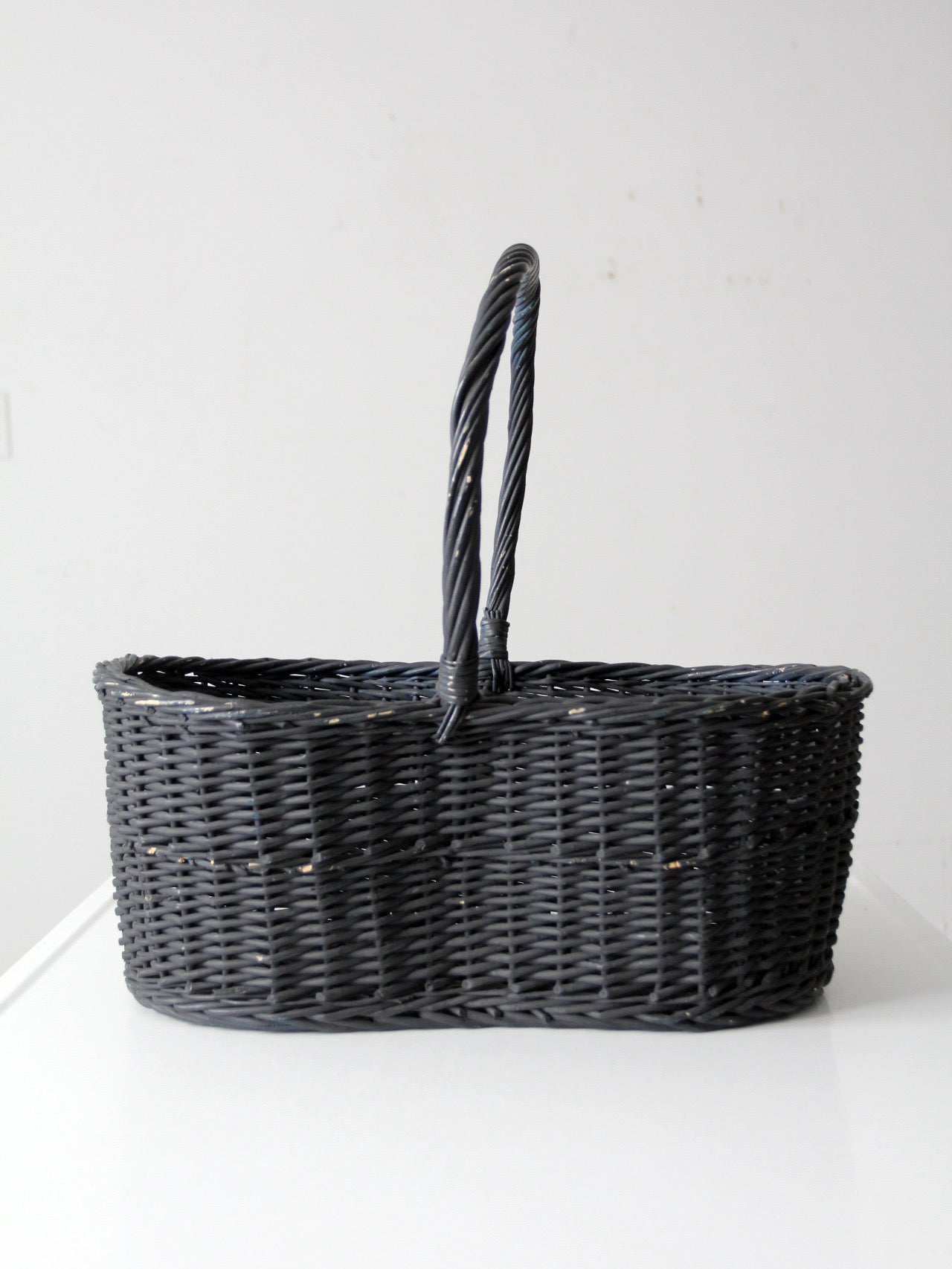 vintage black woven gathering basket