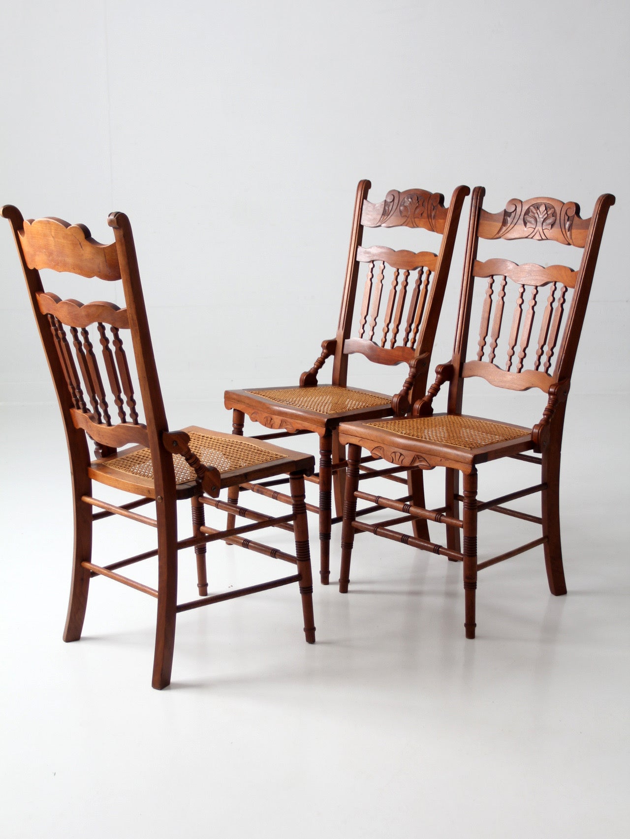 antique Eastlake Revival cane seat dining chairs | set of 3