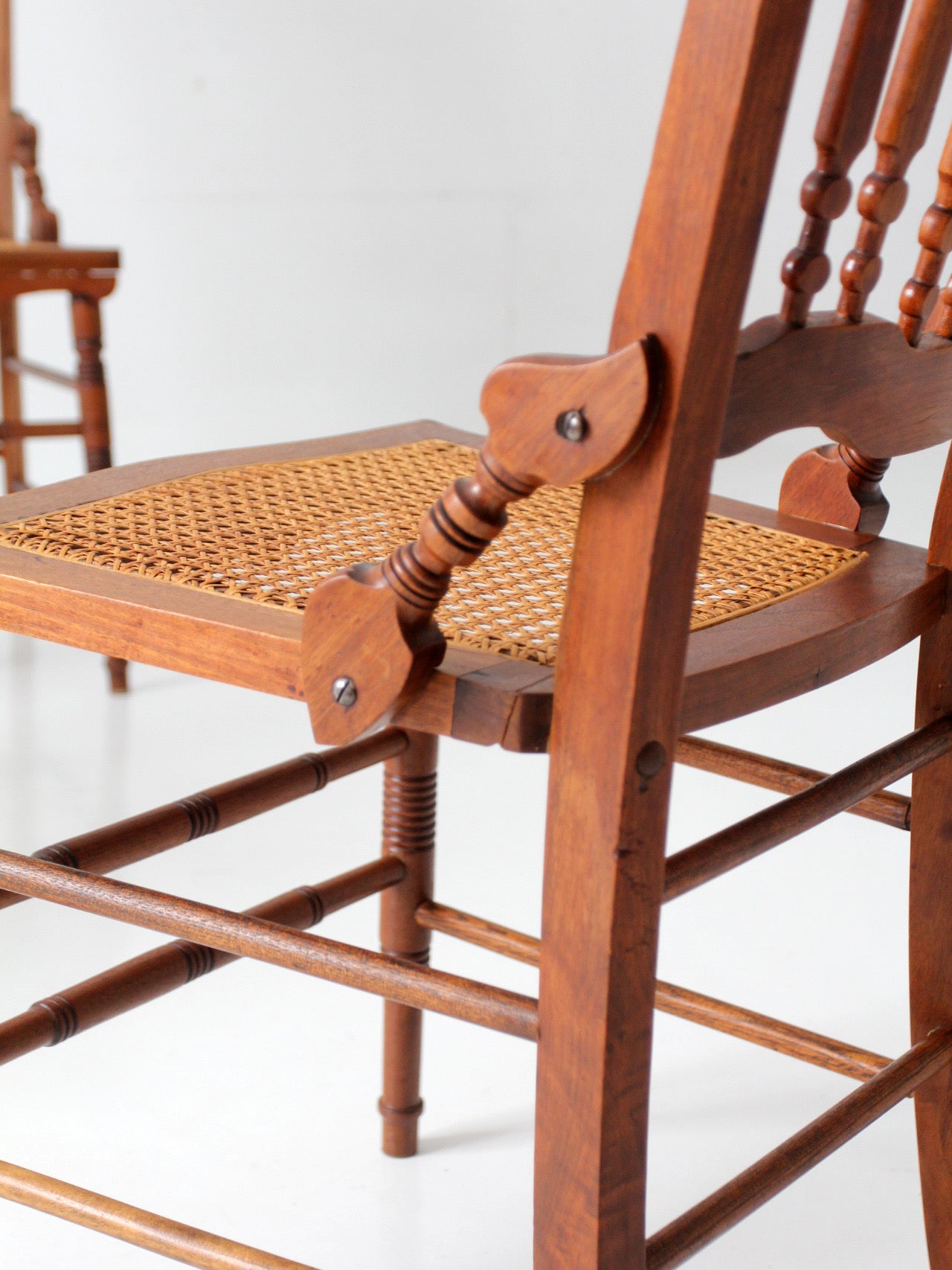 antique Eastlake Revival cane seat dining chairs | set of 3