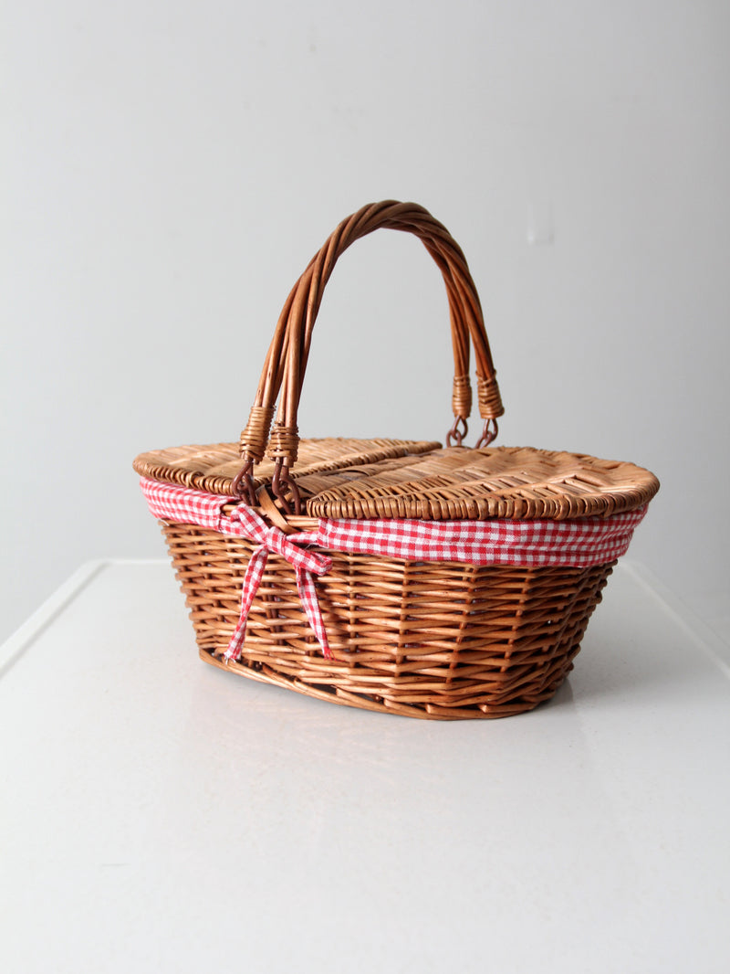 vintage wicker picnic basket with gingham lining