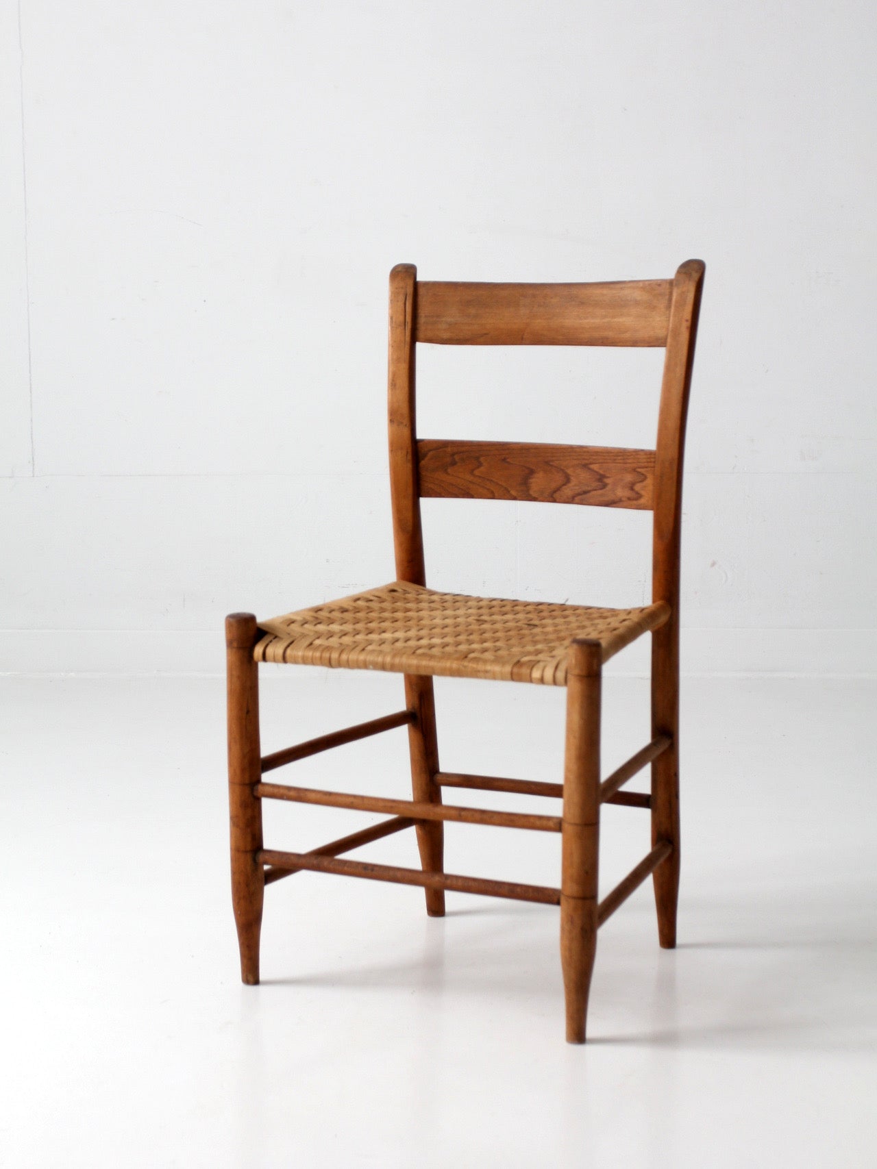 antique ladder back chair with woven splint seat