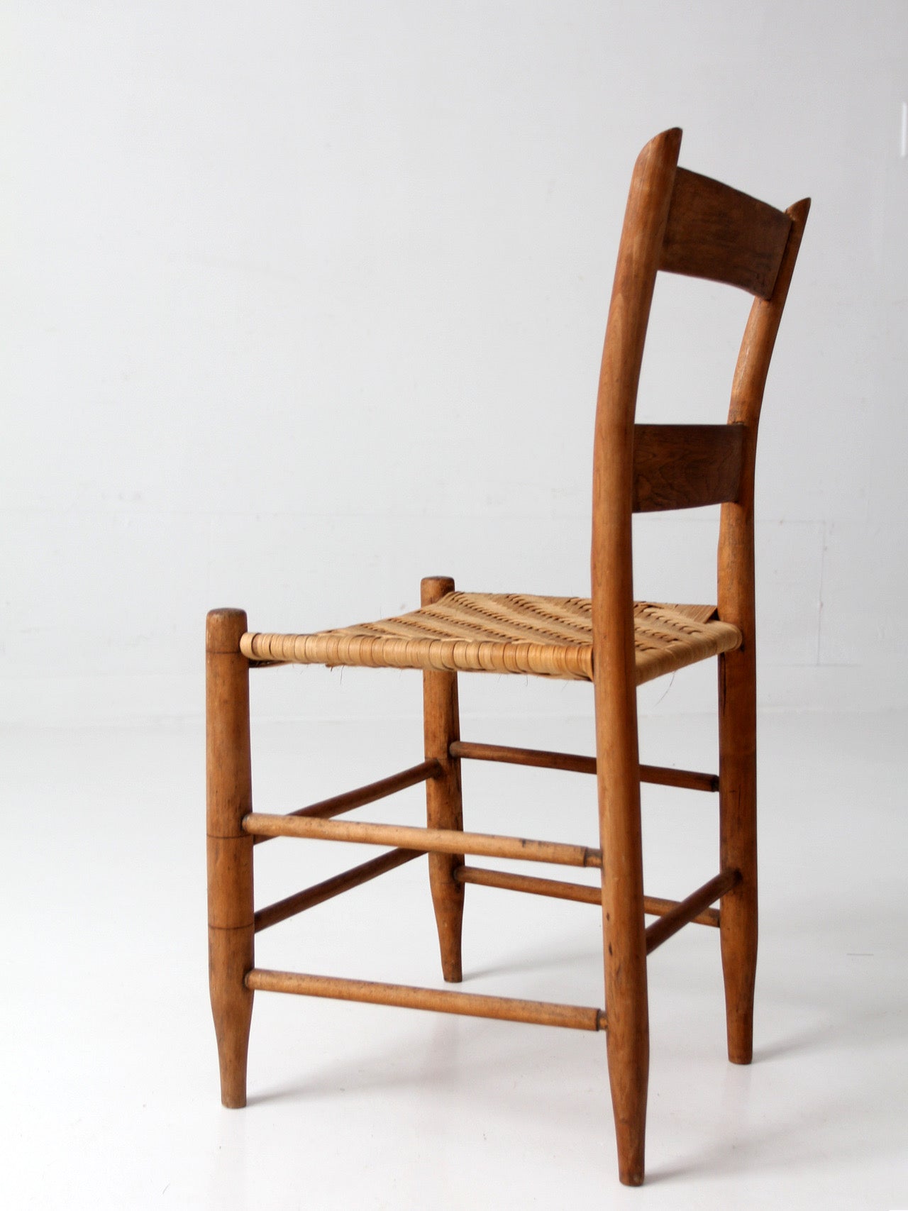antique ladder back chair with woven splint seat
