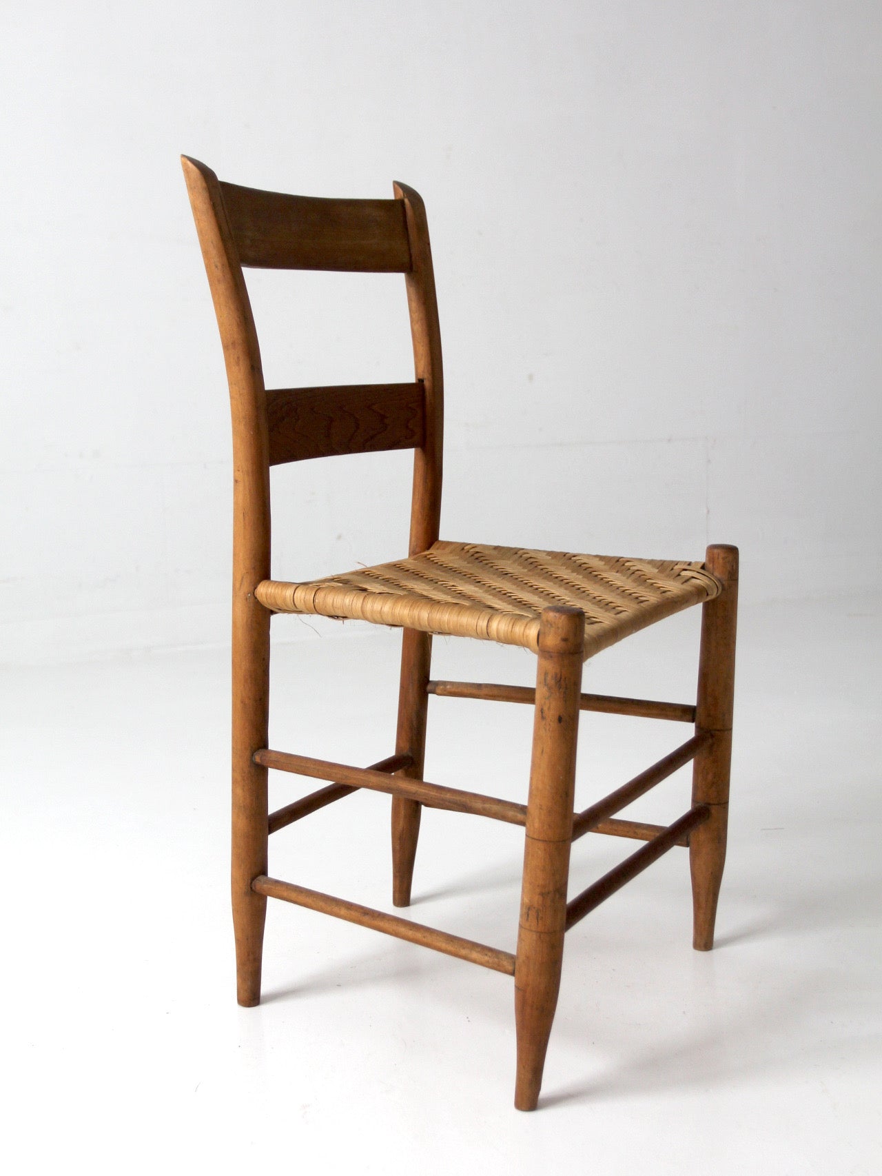 antique ladder back chair with woven splint seat
