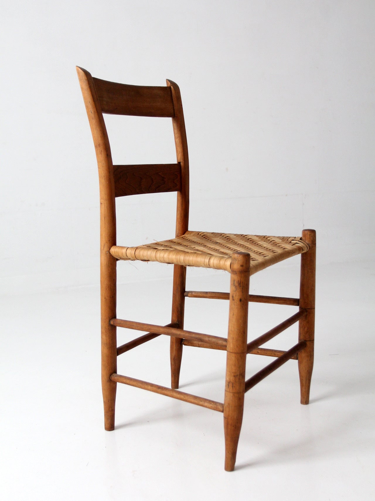 antique ladder back chair with woven splint seat