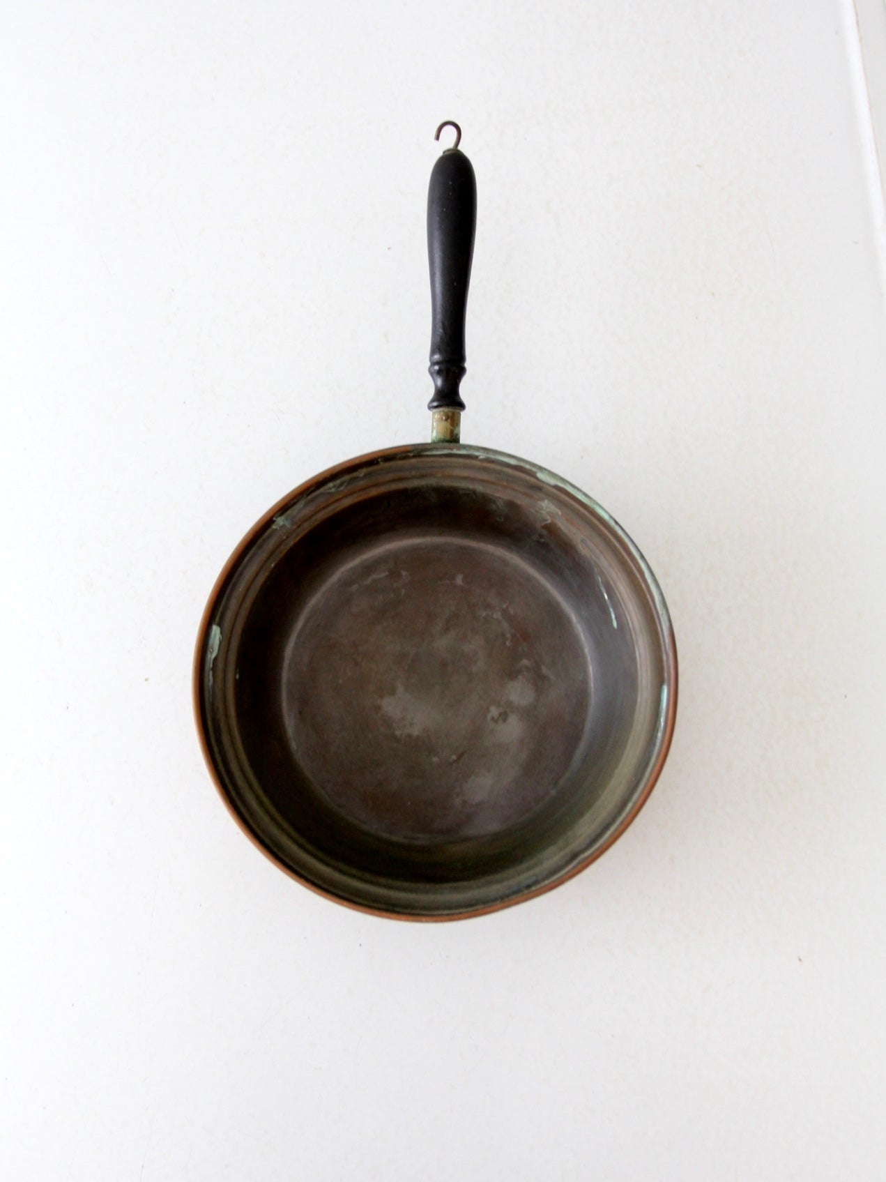 antique copper saute pan with wood handle