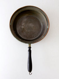antique copper saute pan with wood handle