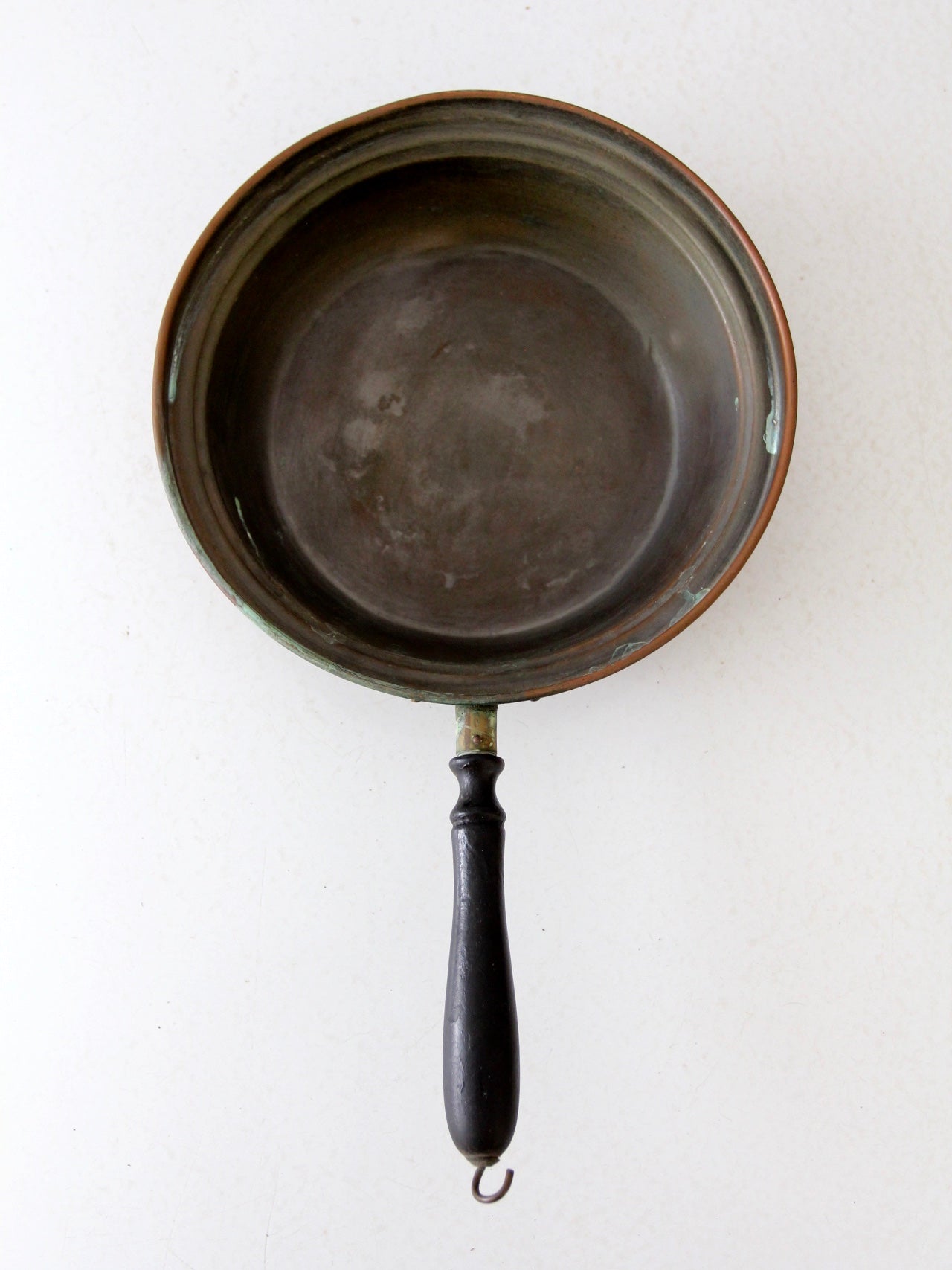 antique copper saute pan with wood handle