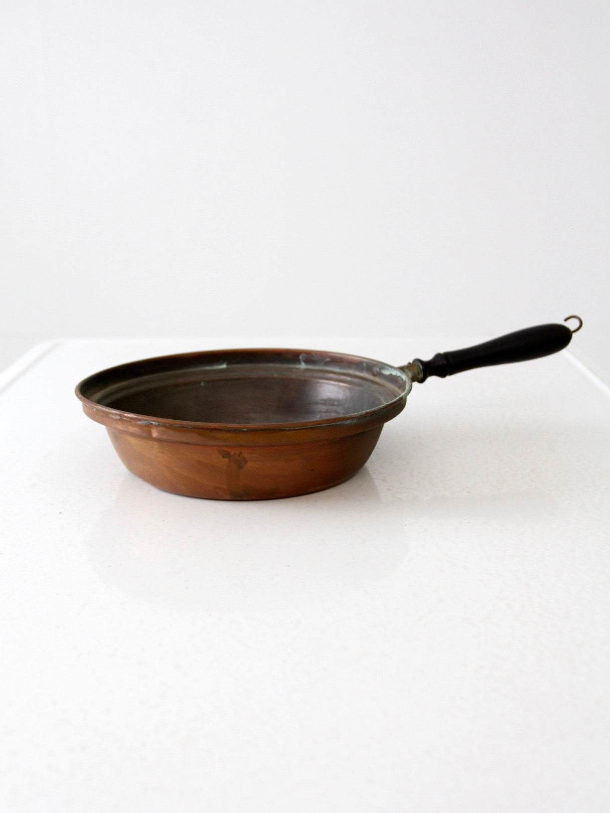 antique copper saute pan with wood handle