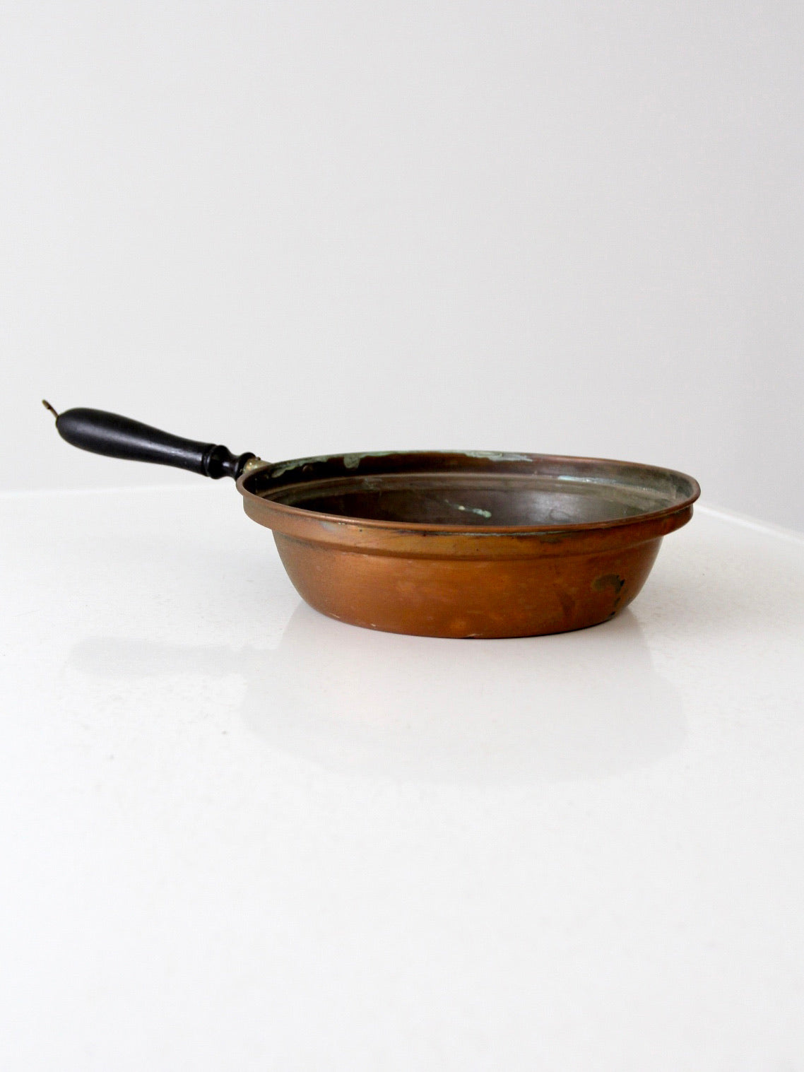 antique copper saute pan with wood handle