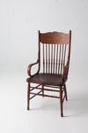 antique pressed back arm chair