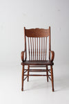 antique pressed back arm chair