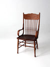 antique pressed back arm chair