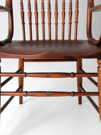 antique pressed back arm chair