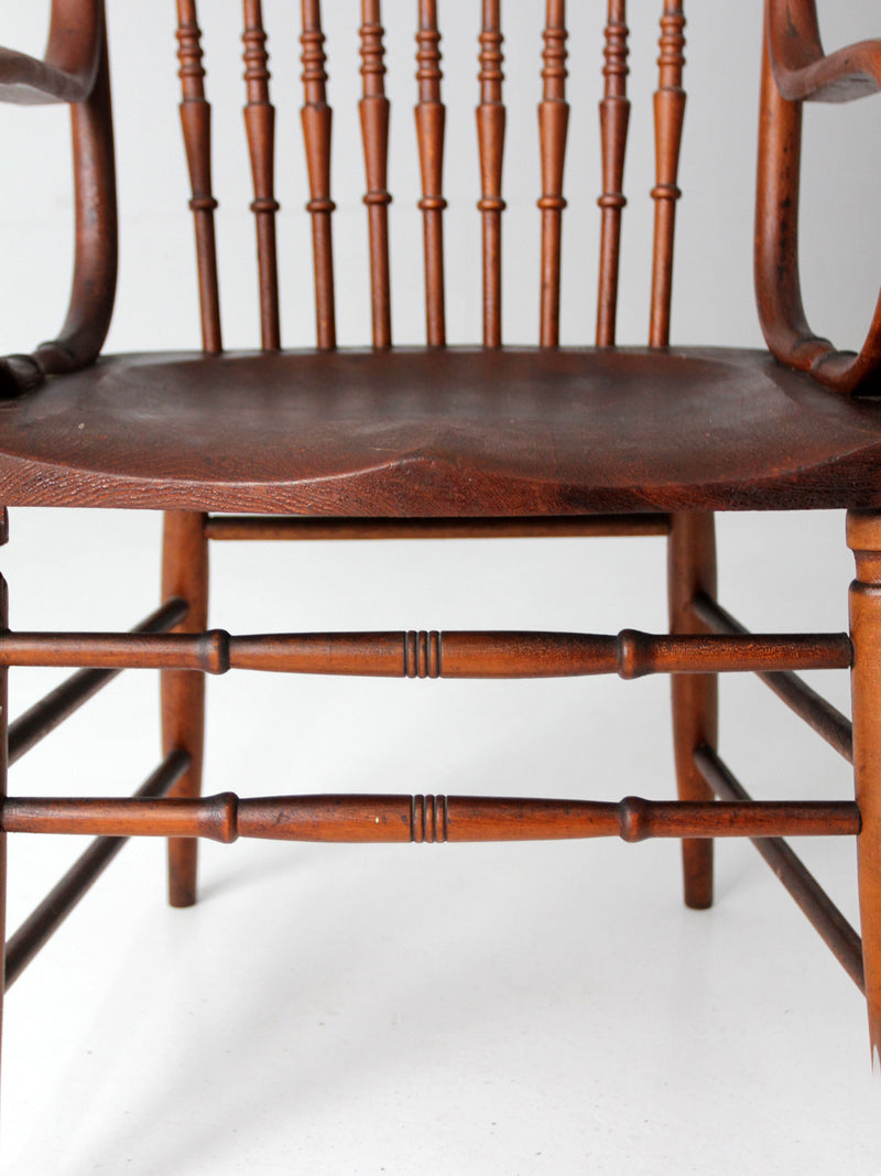 antique pressed back arm chair