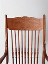 antique pressed back arm chair