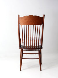 antique pressed back arm chair