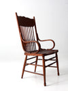 antique pressed back arm chair