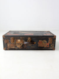 antique leather suitcase with European hotel labels, early 20th century