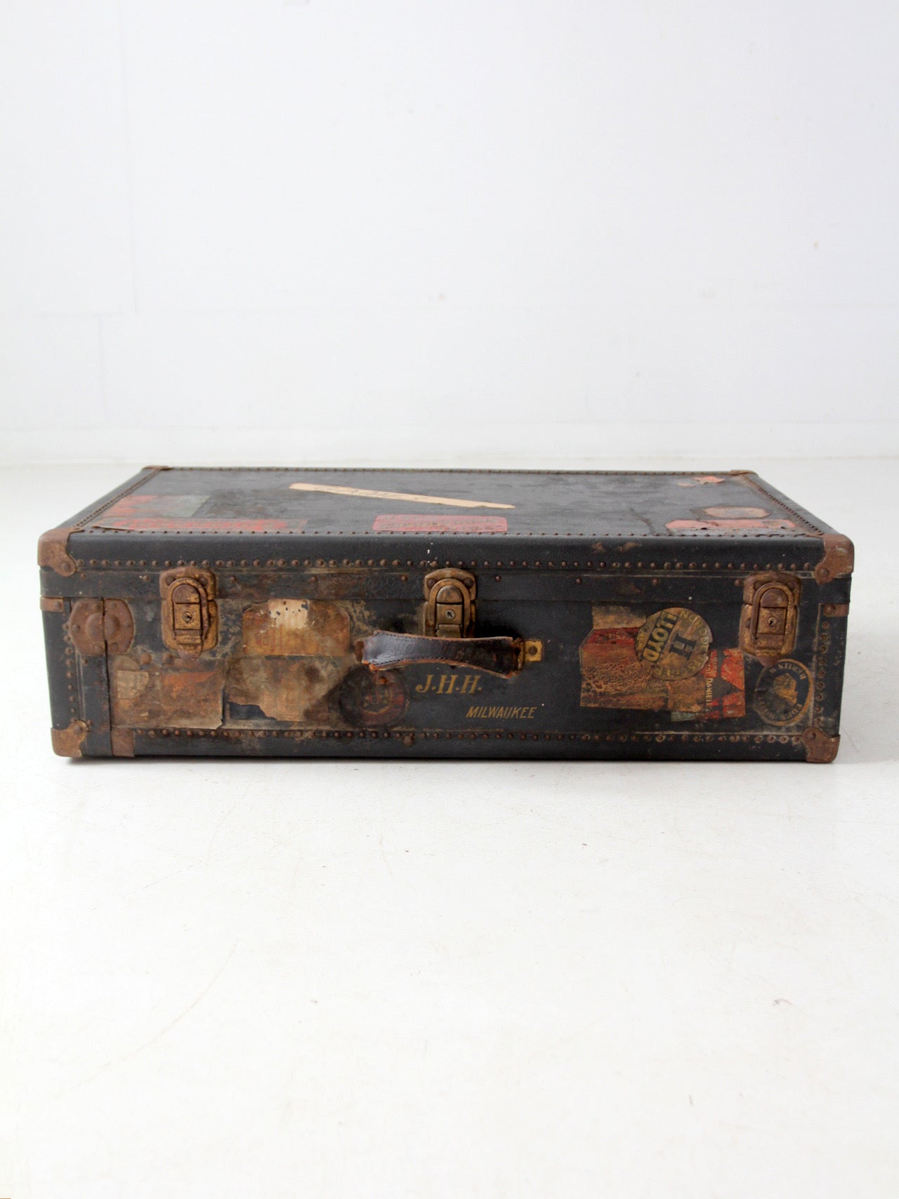 antique leather suitcase with European hotel labels, early 20th century