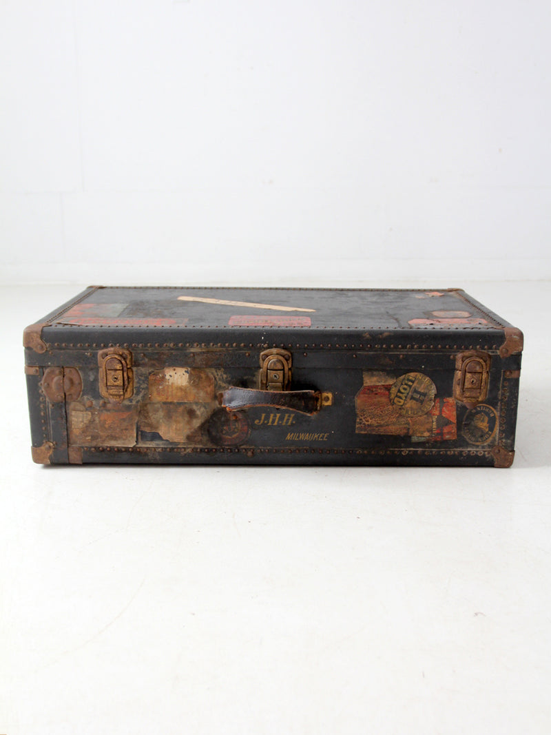 antique leather suitcase with European hotel labels, early 20th century
