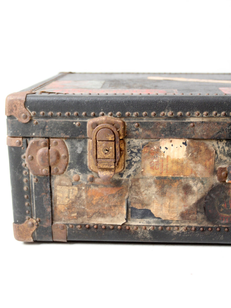 antique leather suitcase with European hotel labels, early 20th century