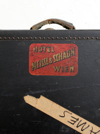 antique leather suitcase with European hotel labels, early 20th century