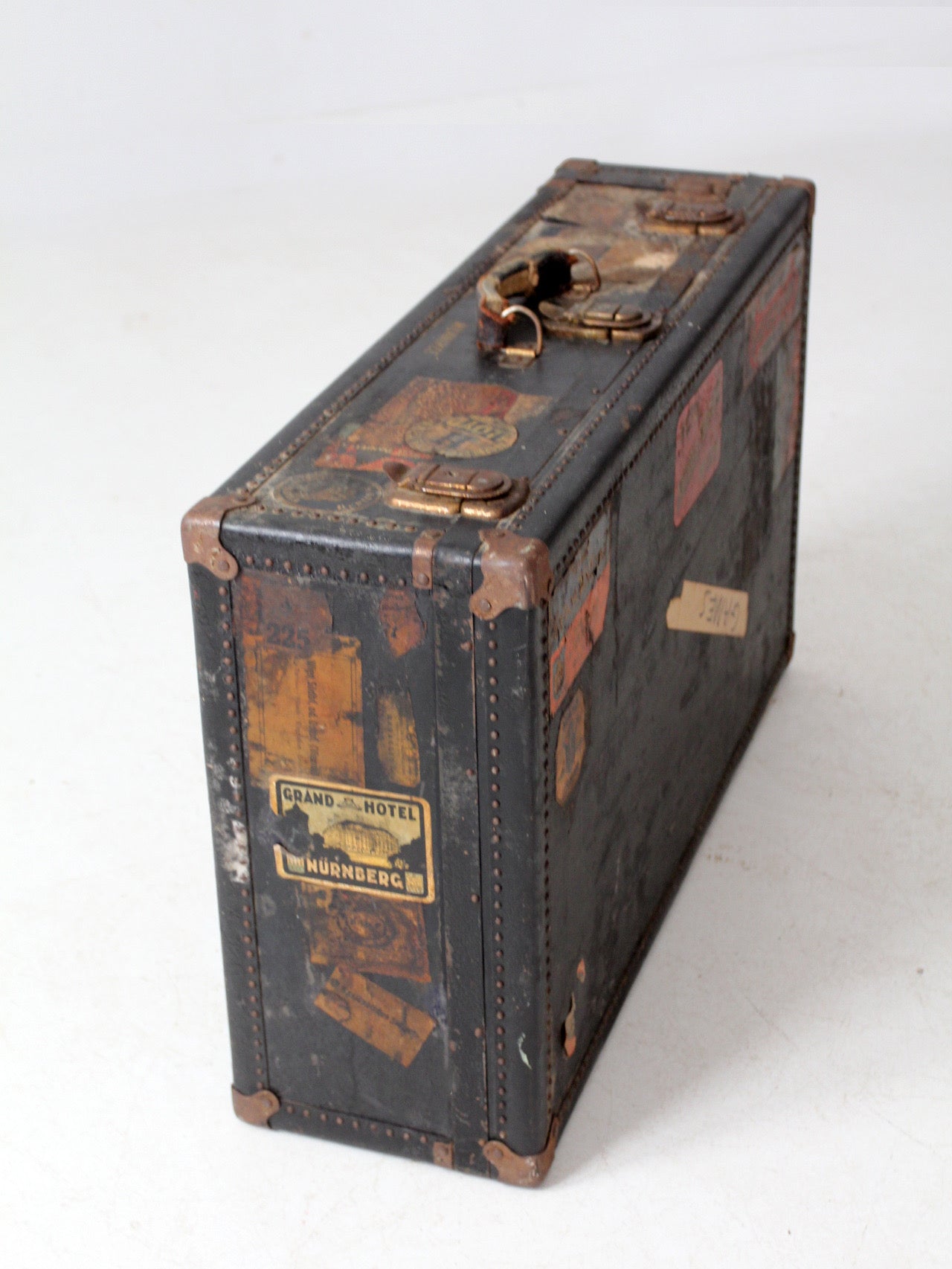 antique leather suitcase with European hotel labels, early 20th century