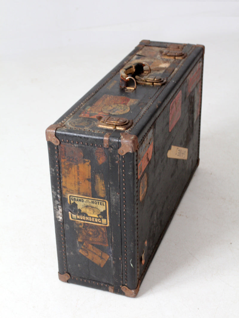 antique leather suitcase with European hotel labels, early 20th century