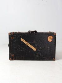 antique leather suitcase with European hotel labels, early 20th century