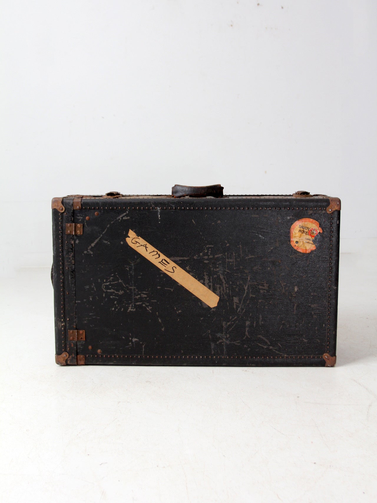 antique leather suitcase with European hotel labels, early 20th century