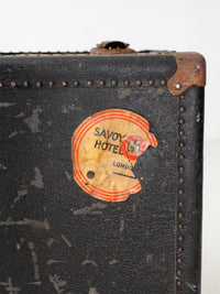antique leather suitcase with European hotel labels, early 20th century