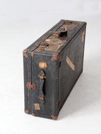 antique leather suitcase with European hotel labels, early 20th century