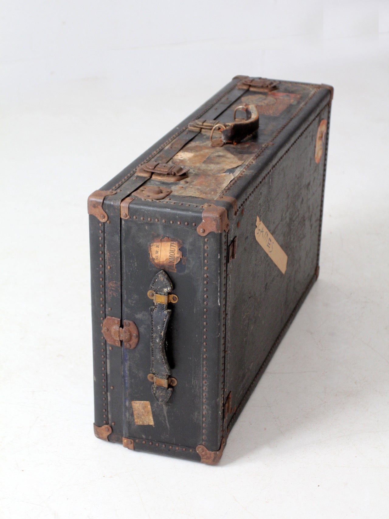 antique leather suitcase with European hotel labels, early 20th century