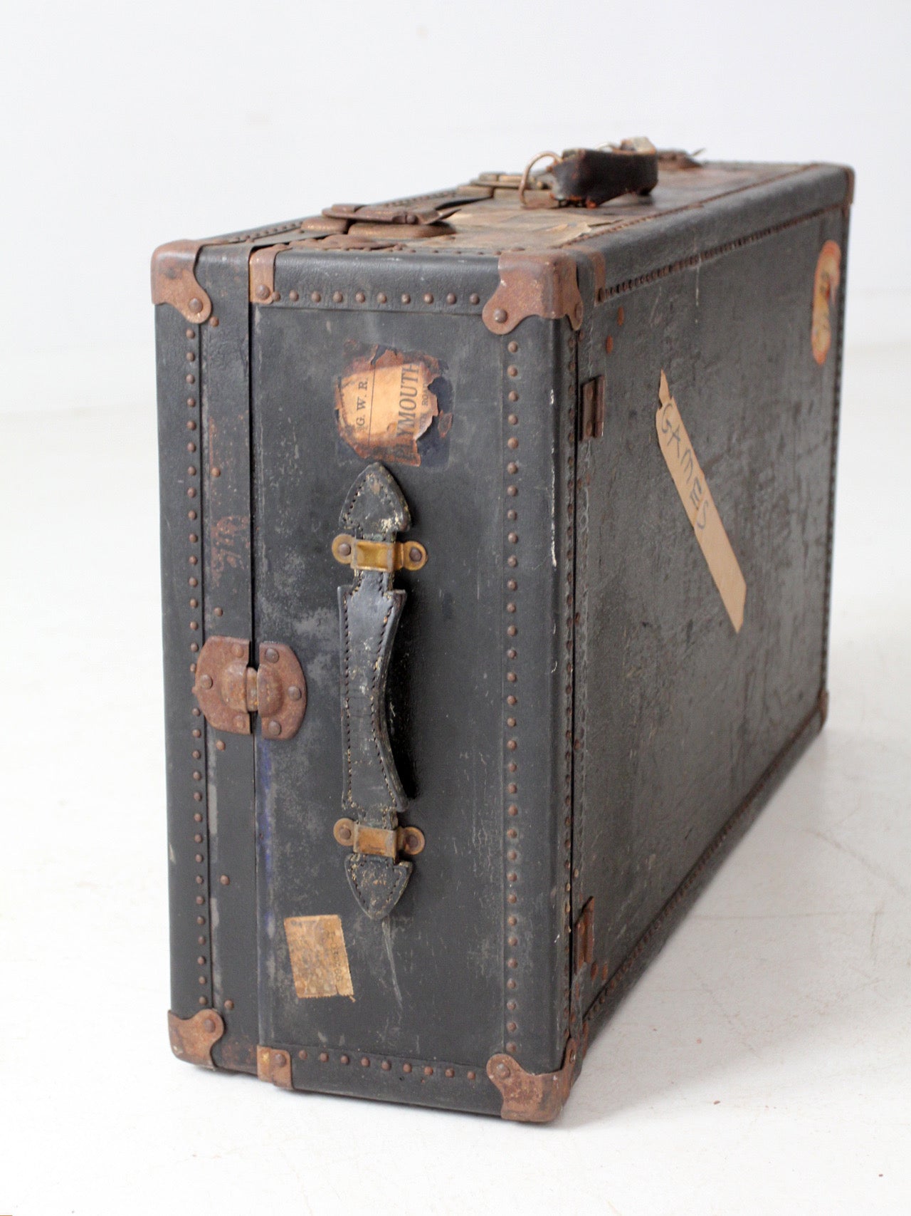 antique leather suitcase with European hotel labels, early 20th century